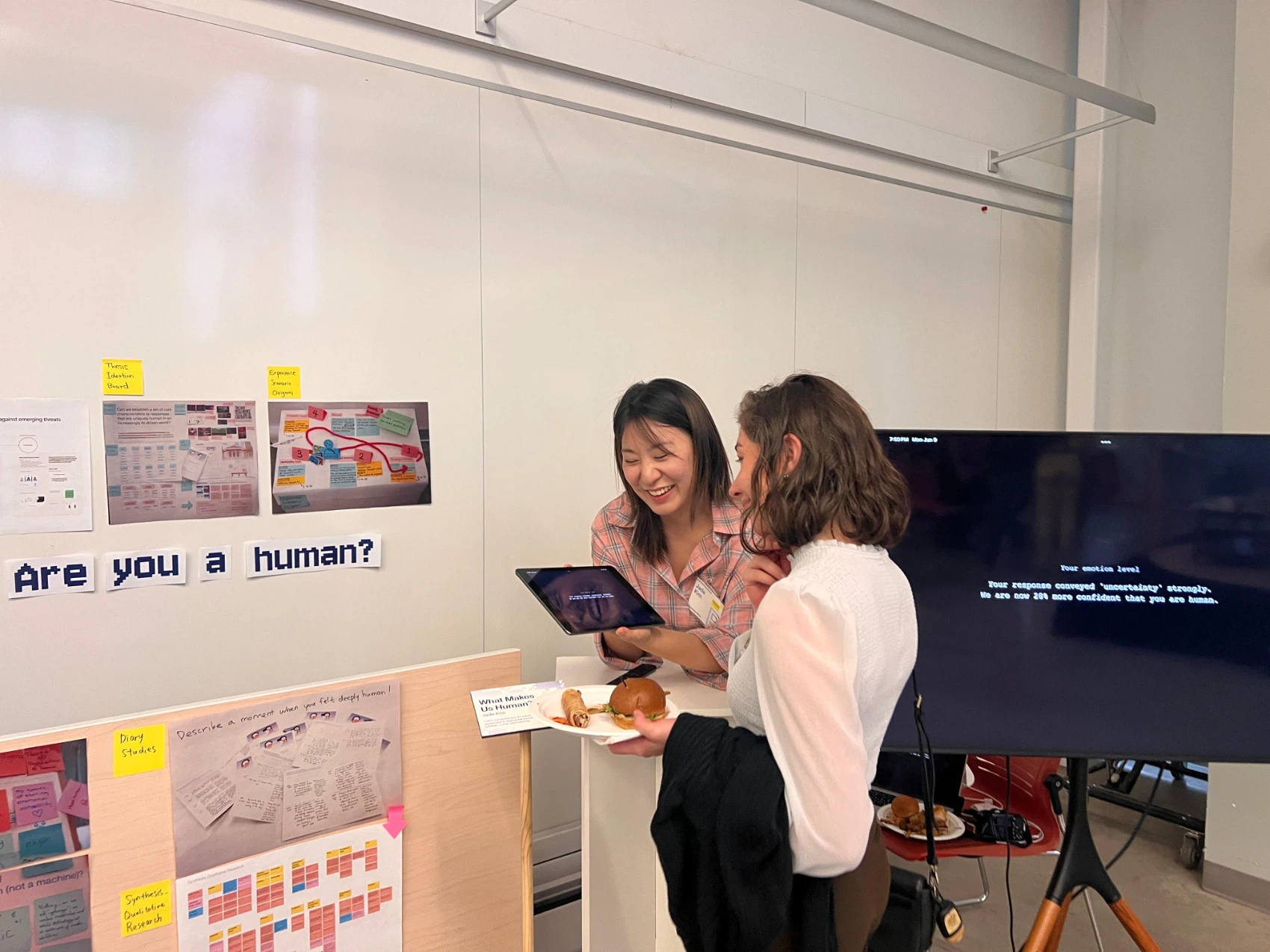Two visitors reading an emotion result on the screen